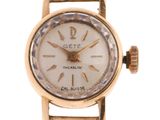 a close up of a wrist watch on a white background