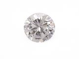 a close up of a diamond on a white surface