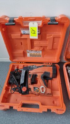 two tools in the orange case on the floor