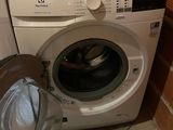 a washer and a dryer in a small room