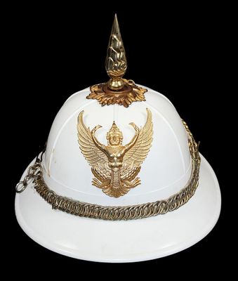 a white and gold helmet with a gold eagle on it