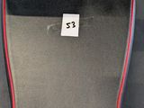 a close up of a seat in a car with a sticker on it