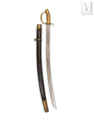 an old dagger with a wooden handle and brass fittings