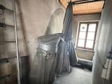an image of a room with a ladder and a trash can