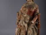 an image of a statue of a woman sitting on a chair