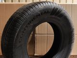 tires are stacked on a cardboard box in a warehouse