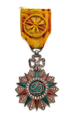 l'image d'une médaille surmontée d'une étoile