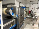 a conveyor belt in the middle of a factory