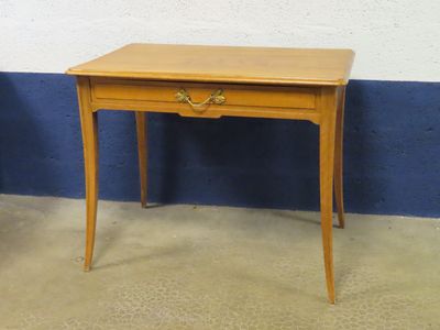 a small wooden table with a drawer on top of it