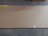 a piece of cardboard sitting on the floor next to a cardboard box