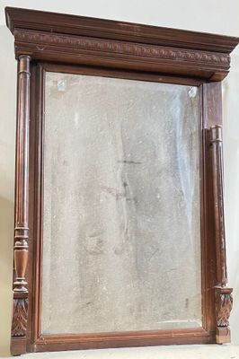a mirror that is sitting on top of a shelf