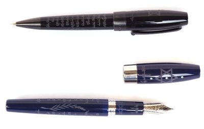 three different types of fountain pens are lined up on a white surface