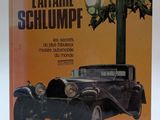 un vieux livre dont la couverture représente une vieille voiture