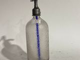 a glass bottle with a blue line on it