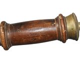 a wooden pole with a brass handle on it