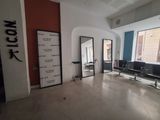 an image of a hair salon with mirrors and chairs