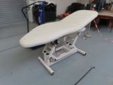 a white ironing board sitting on top of a table