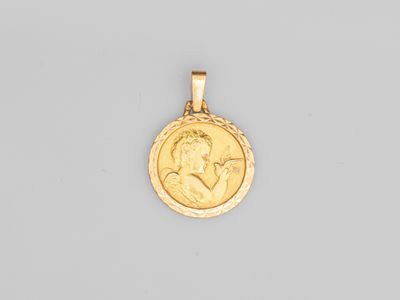 une pièce d'or sur laquelle est représenté le profil d'un homme