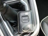 a leather gear box in the center console of a car
