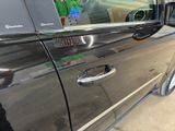 a car that has a sticker on the side of it ' s door