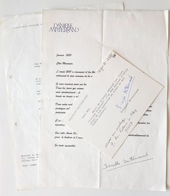 several papers are stacked on top of each other on a table