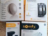 three boxes of sonfy products sitting on a wooden surface