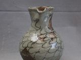 a small vase that is sitting on a table