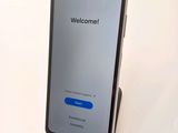 an image of a cell phone with a welcome screen on it