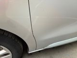 a close up of a car that has a denting on it