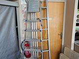 a ladder that is leaning against a wall in a room