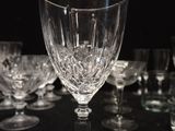 a lot of wine glasses sitting on a table