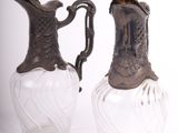 two vases that are sitting next to each other on a table