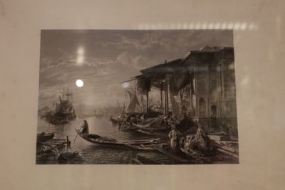 a black and white photo of a boat in the water