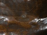 a close up of a brown bag on a table