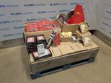 a box of food sitting on a pallet in front of a wall