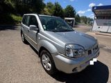 a picture of a silver car parked in a parking lot