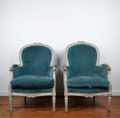 pair of blue velvet upholstered chairs in the style of louis xv