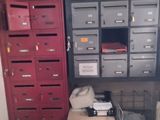 many drawers and boxes in a room with a lot of stuff