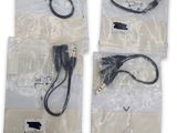four different types of cables and cords in bags on a white surface