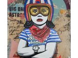 painting of a woman wearing a helmet and bandana with a red star on it