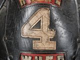 a close up of a fireman ' s helmet with the number 4 on it