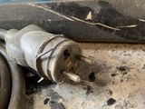 a close up of a power cord on the ground