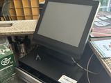 an image of a cash register machine with a box of beer