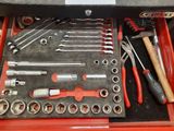 many tools in a tool box on the table
