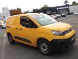the yellow van is parked in a parking lot with other cars in the background