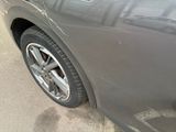 a close up of a car ' s tire on the street