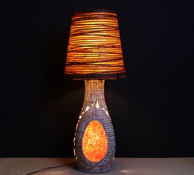 a lamp that is sitting on a table with a lamp on it