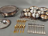 a lot of silverware on the table and silverware on the table