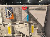 a display of kites hanging on the wall in a store