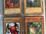 four different types of pokemon cards are in a plastic case